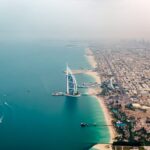 an aerial view of the burj al arab in the middle of the ocean